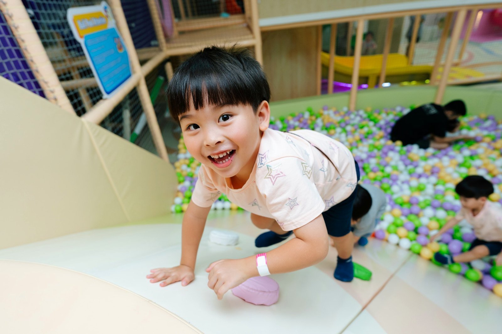 Happy child enjoying DreamDora indoor playground